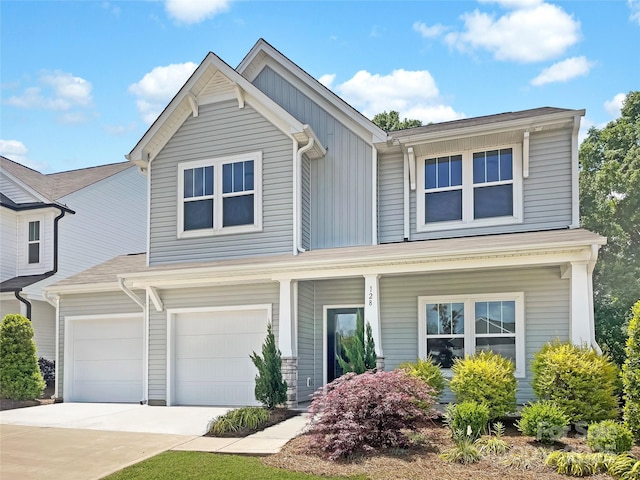 128 Shay Crossing Rd, Salisbury, NC 28146 - view of front of house featuring concrete driveway, board and batten siding, covered porch, and an attached garage