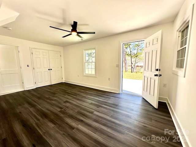 interior space featuring ceiling fan, dark hardwood / wood-style floors, and access to outside