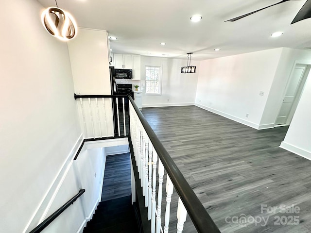 stairway with hardwood / wood-style flooring