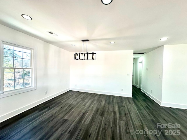 unfurnished room featuring dark hardwood / wood-style floors