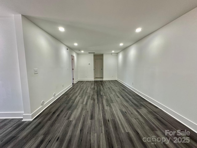 spare room with dark hardwood / wood-style flooring