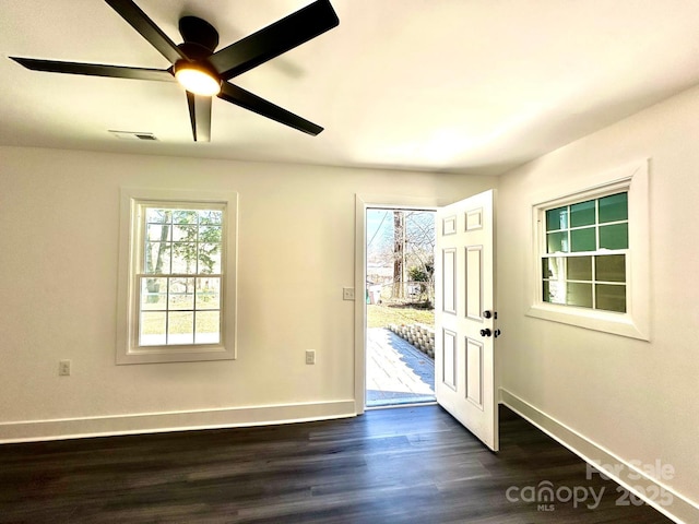 entryway with dark hardwood / wood-style flooring and ceiling fan