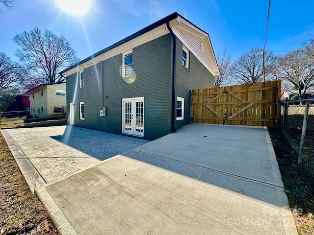 back of house featuring french doors and a patio