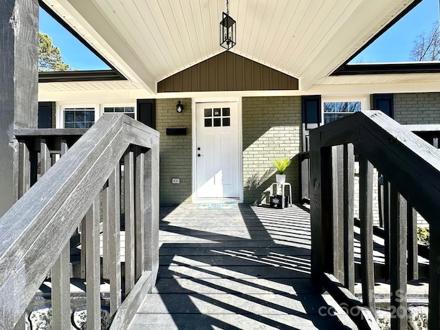entrance to property with brick siding