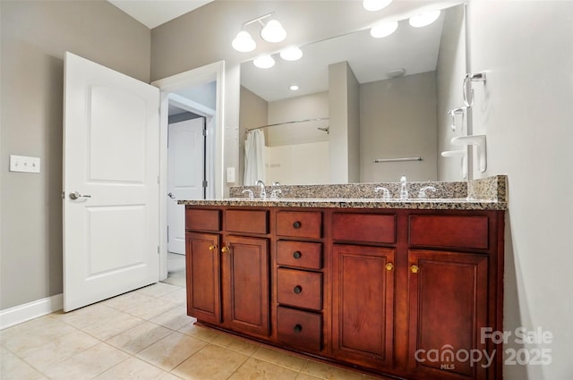 128 Steinbeck Way Unit E, Mooresville, NC 28117 - full bath featuring a sink, tile patterned floors, baseboards, and double vanity