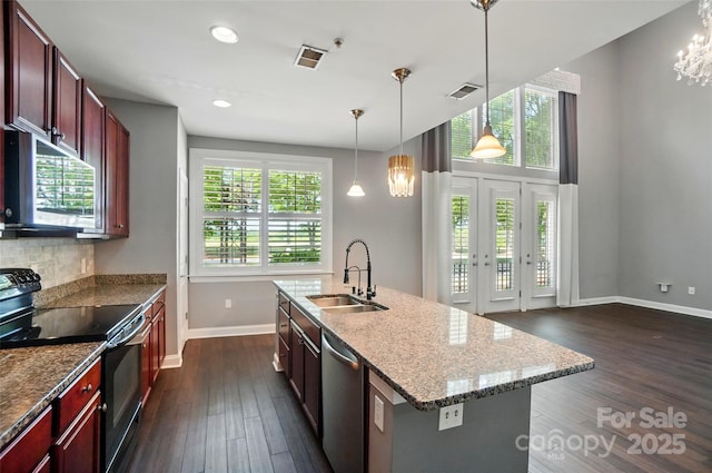 128 Steinbeck Way Unit E, Mooresville, NC 28117 - kitchen featuring visible vents, a sink, baseboards, dark wood-style floors, and stainless steel appliances