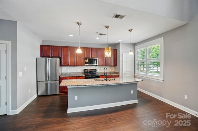 128 Steinbeck Way Unit E, Mooresville, NC 28117 - kitchen featuring baseboards, a sink, tasteful backsplash, and stainless steel appliances