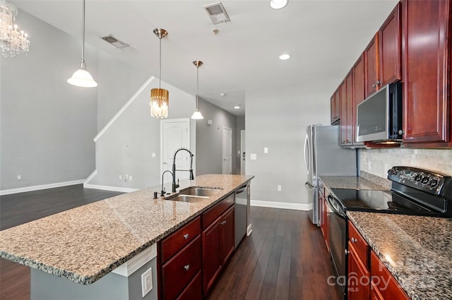 128 Steinbeck Way Unit E, Mooresville, NC 28117 - kitchen with visible vents, appliances with stainless steel finishes, dark brown cabinets, a sink, and dark wood-style floors