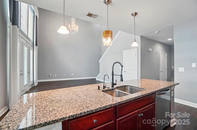 128 Steinbeck Way Unit E, Mooresville, NC 28117 - kitchen with dark wood-style flooring, dark brown cabinets, an inviting chandelier, a sink, and visible vents