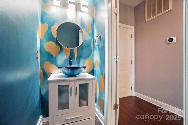 128 Steinbeck Way Unit E, Mooresville, NC 28117 - interior space with visible vents, baseboards, wood finished floors, and vanity