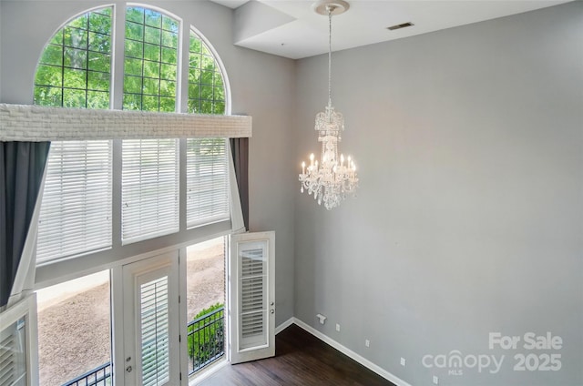 128 Steinbeck Way Unit E, Mooresville, NC 28117 - interior space featuring an inviting chandelier, baseboards, dark wood-style flooring, and visible vents