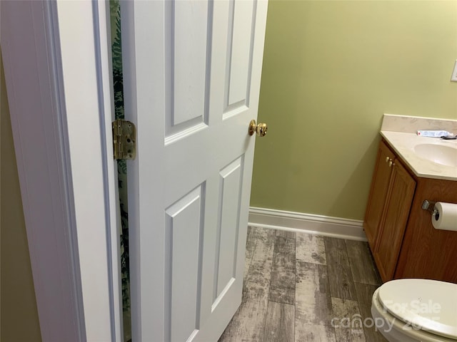 7 Chapel Park Pl, Asheville, NC 28803 - bathroom with vanity, toilet, and hardwood / wood-style floors