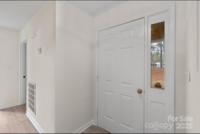 entryway with light hardwood / wood-style floors