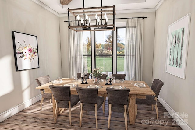 dining room with a notable chandelier, baseboards, and crown molding