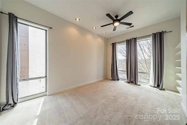 carpeted empty room with ceiling fan