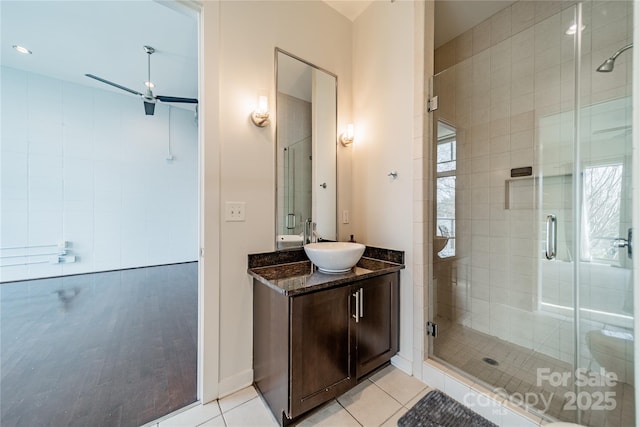 bathroom with vanity, tile patterned floors, and walk in shower