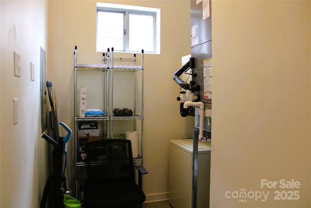 clothes washing area with washer / clothes dryer