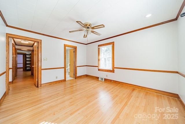 empty room featuring crown molding, ceiling fan, and light wood-type flooring