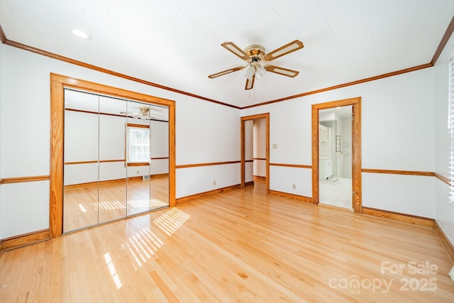 interior space with ceiling fan, crown molding, and light wood-type flooring