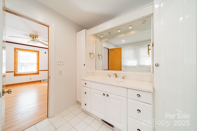 bathroom with ceiling fan, vanity, and tile patterned floors