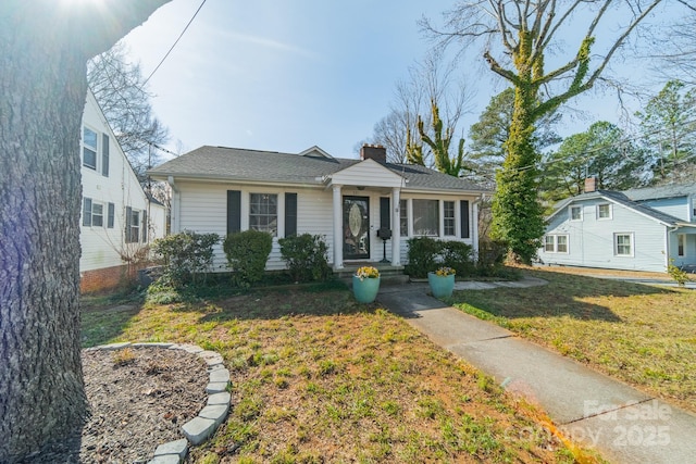 531 Elm St, Salisbury, NC 28144 - bungalow featuring a front lawn and a chimney
