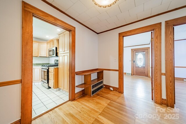 531 Elm St, Salisbury, NC 28144 - hallway featuring ornamental molding, light wood-type flooring, baseboards, and recessed lighting