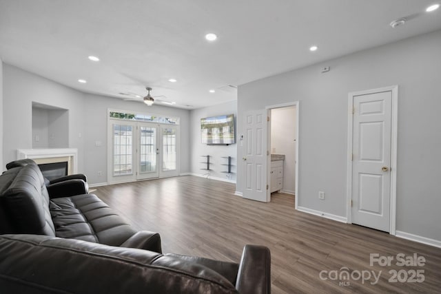 living room with french doors, ceiling fan, and hardwood / wood-style flooring