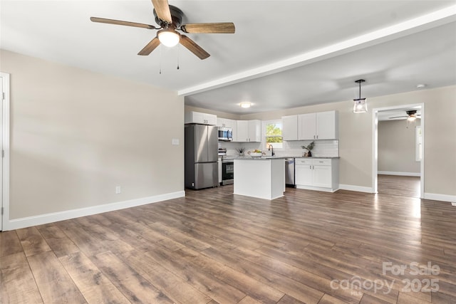 2525 Oxford Cir, Lancaster, SC 29720 - kitchen featuring sink, white cabinetry, hanging light fixtures, stainless steel appliances, and a center island