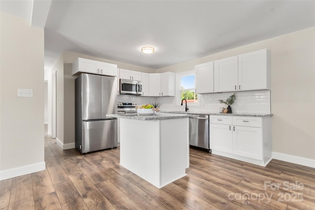 2525 Oxford Cir, Lancaster, SC 29720 - kitchen featuring light stone counters, appliances with stainless steel finishes, and white cabinets