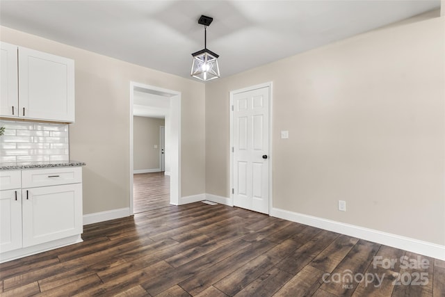 2525 Oxford Cir, Lancaster, SC 29720 - unfurnished dining area featuring dark hardwood / wood-style flooring