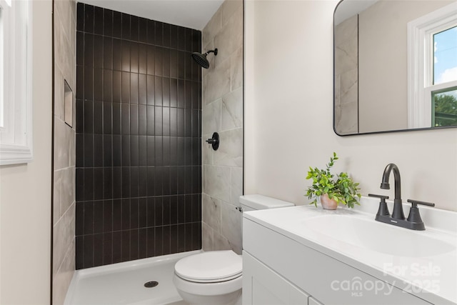 2525 Oxford Cir, Lancaster, SC 29720 - bathroom featuring vanity, a tile shower, and toilet