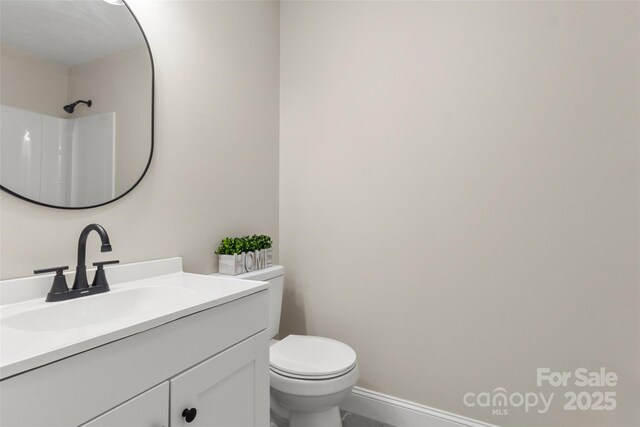 2525 Oxford Cir, Lancaster, SC 29720 - bathroom with walk in shower, vanity, and toilet