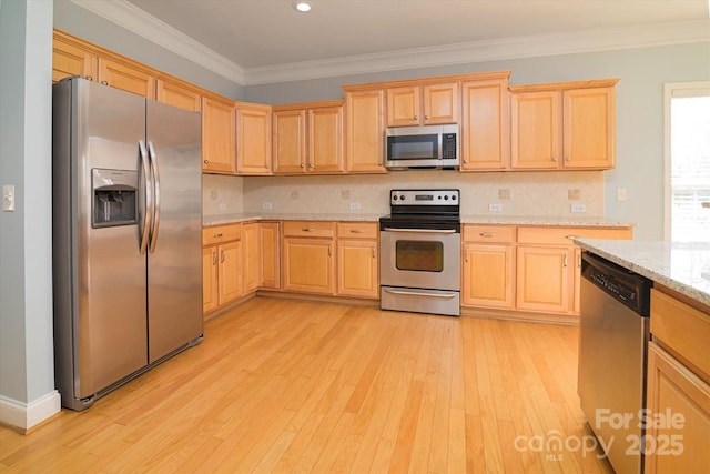 kitchen featuring crown molding, appliances with stainless steel finishes, light stone counters, light hardwood / wood-style floors, and decorative backsplash