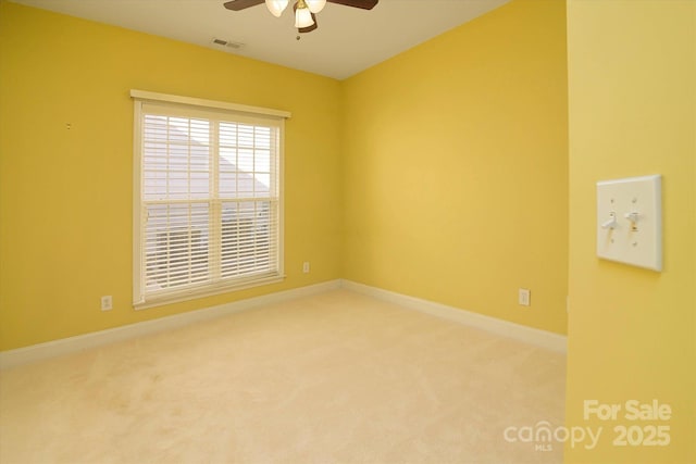 carpeted empty room with ceiling fan