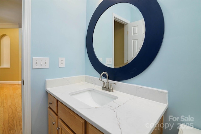 bathroom featuring hardwood / wood-style flooring and vanity