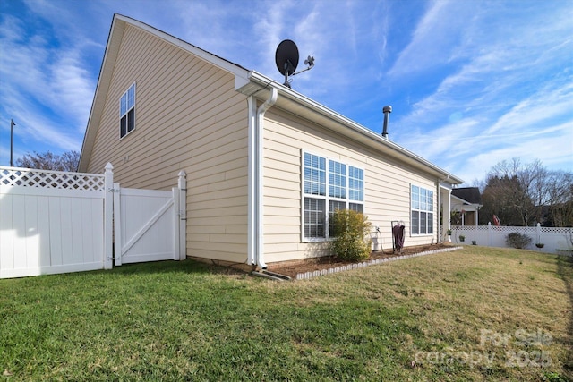 view of home's exterior featuring a lawn