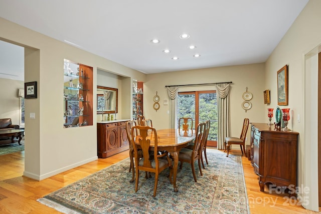 dining area with light wood-type flooring