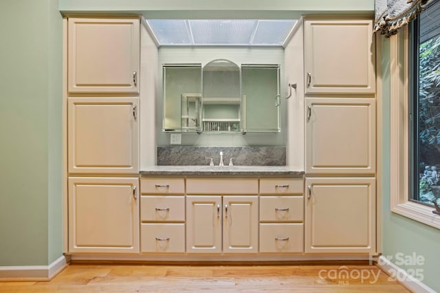 bathroom with vanity and hardwood / wood-style flooring