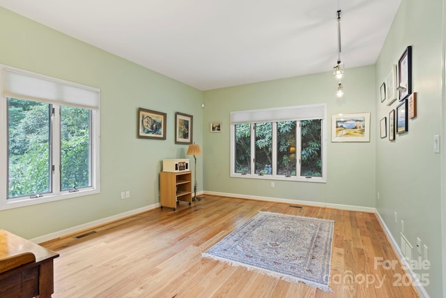 unfurnished room featuring light hardwood / wood-style floors