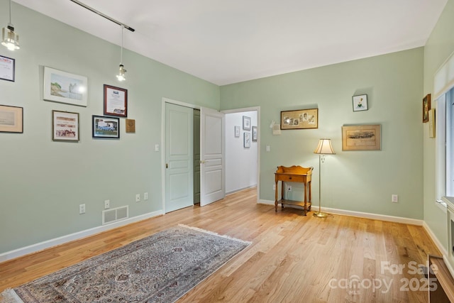 living area with light hardwood / wood-style flooring