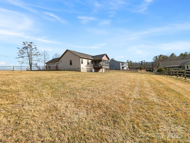 view of yard with a rural view