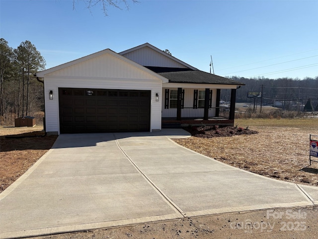 view of front of home featuring a garage and a porch