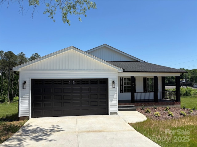 ranch-style home featuring driveway, a porch, and an attached garage
