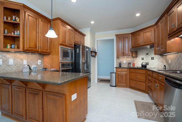 kitchen with pendant lighting, dark stone countertops, kitchen peninsula, stainless steel appliances, and crown molding