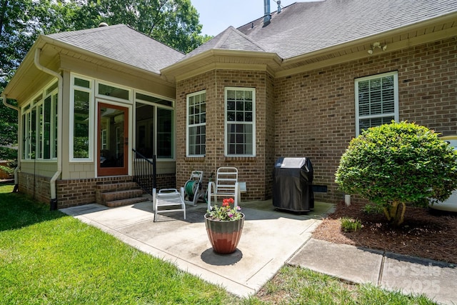 back of house with a yard and a patio area