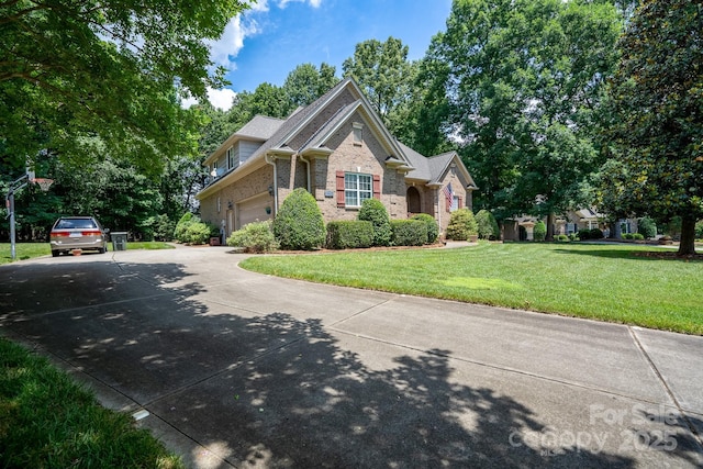 view of front of home with a garage and a front lawn