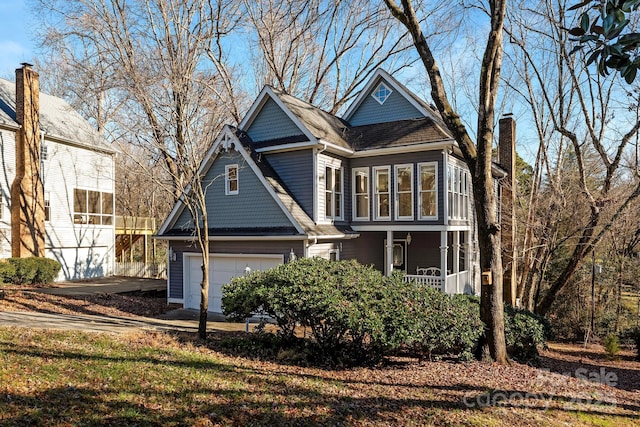 front of property with a garage