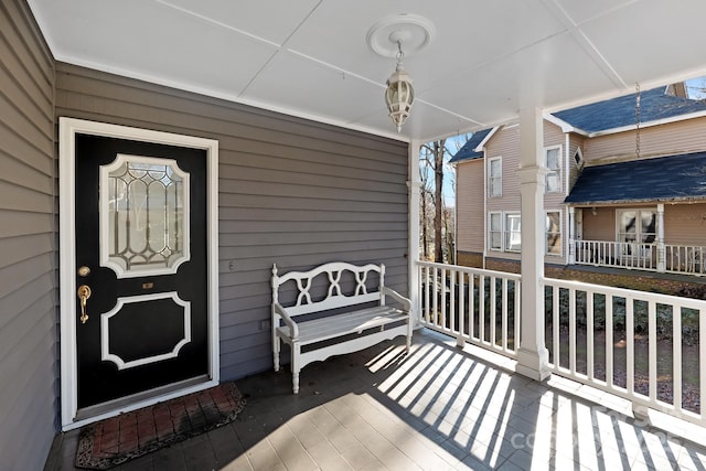 doorway to property with covered porch