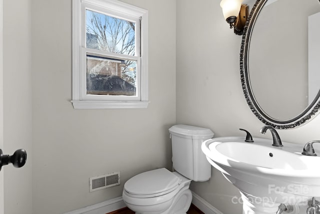 bathroom with sink and toilet