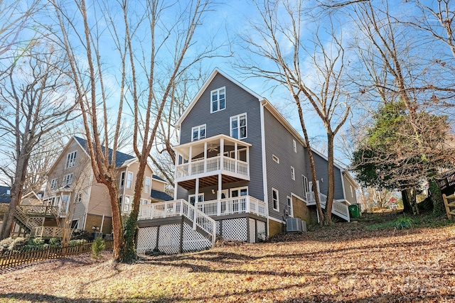 rear view of house featuring a deck and central AC unit